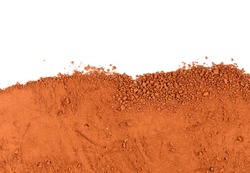 Heap of Red dry clay isolated on white background. Ochre, also spelled ocher, a natural yellow earth pigment. Pile of Red dirt (soil) on white. 