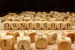 Ownership word written on wood block