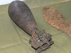 A rusty mortar shell from the Second World War. An artillery mine. Ammunition for firing mortars.
