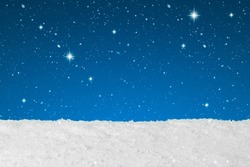 Christmas concept showing snow falling and stars on a background