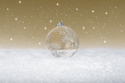 Clear Glass Christmas Bauble on fake white snow
