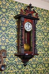 Photo of an old antique clock in a restaurant 
