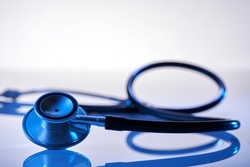 Close up stethoscope on blue background              