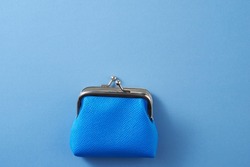 blue coin purse on blue background               