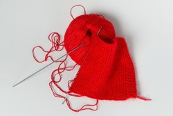 Red yarn with spokes on white background