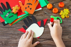 Instructions, step 15. Greeting card halloween on wooden table. Children's creativity project, crafts, crafts for kids.