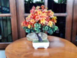 gaussian blur of flower decoration on the brown table