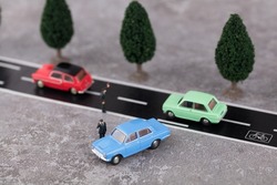 Miniature world roadside traffic police inspecting vehicles