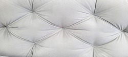 soft foam sofa with folded, gray stitched