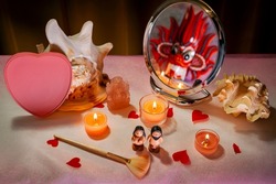 A ladies ' table with a reflection in the mirror and a heart .. Concept for Valentines Day or Womens Day or Mothers Day.