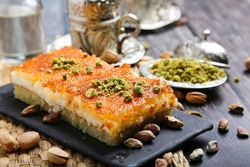 Basbousa with cream and pistachio is one of the traditional dishes in the Middle East

