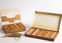 Arabic Sweets or Desserts arabic baklava
Middle East and Arabic desserts, Ramadan sweets (konafa and Baklava) decorated in a gift box
