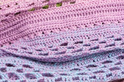 handmade multicolor crochet background in blue, pink and purple with double crochet stitches