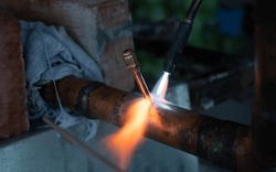 gas welding of copper pipes close-up