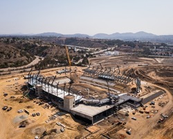 Aerial view of construction crews building new stadium arena in San Diego. High quality photo