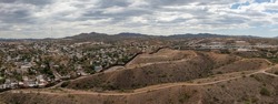 Aerial view of US Mexico Border fence in Nogales, Arizona. Drone panorama. 