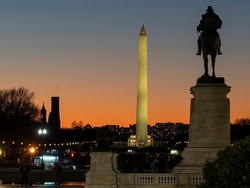Sunset over the Washington Monument and the Ulysses S Grant Memorial on the National Mall in Washington DC.