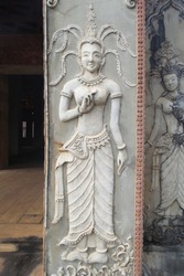 Sculptural relief in stone carving of traditional female goddess known as an Apsara