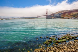 Landscape of Golden Gate Bridge from Presidio Yacht Club, north shore, Horseshoe Bay, Sausalito, California, United States. Symbol, icon and landmark of San Francisco. Travel and holidays concept.