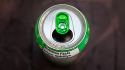 Green Pop Can Top of Soda Lid Wallpaper. Open Cola Tab and Refreshing Drink on a Hot Summer Day