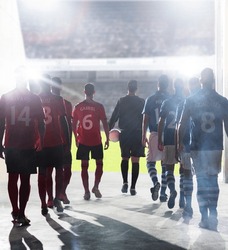 Silhouette of soccer players walking to field