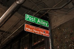 Post Alley and Pike Place Market directional signs at the gum wall in Seattle, Washington, USA