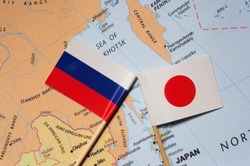 japan and russia flags placed on a map of east Asia.Selective focus on flag.
 Local conflicts. Territorial disputes.Border crisis. Tensions. Danger of war.Four Northern Islands Disputes.Kuril Islands.