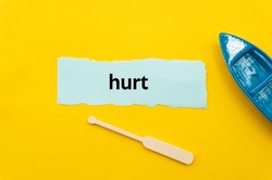 hurt.The word is written on a slip of paper. Emotional nouns, feeling words, emotional phrases. Positive or negative attitudes.