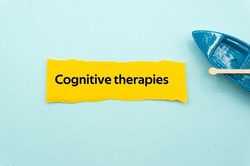 Cognitive therapies.The word is written on a slip of colored paper. Psychological terms, psychologic words, Spiritual terminology. psychiatric research. Mental Health Buzzwords.
