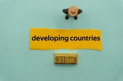 developing countries.The word is written on a slip of paper,on colored background. professional terms of finance, business words, economic phrases. concept of economy.