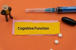Cognitive Function.The word is written on a slip of colored paper. health terms, health care words, medical terminology. wellness Buzzwords. disease acronyms.