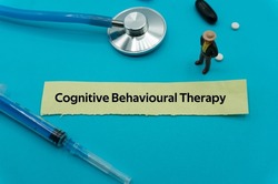 Cognitive Behavioural Therapy.The word is written on a slip of colored paper. health terms, health care words, medical terminology. wellness Buzzwords. disease acronyms.