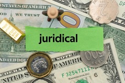 juridical.The word is written on a slip of paper,on colored background. professional terms of finance, business words, economic phrases. concept of economy.