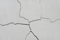 Ð¡racks in the white wall. Texture of cracks in a old wall                               