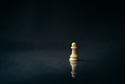 white pawn on a dark, black background, reflection, chess piece