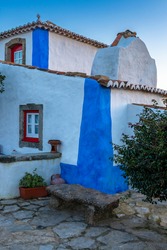 Detail of a traditional house painted in white and blue, near Mafra, Portugal.