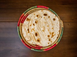 Premium Photo  Tawa chapati roti served in plate isolated on table top  view of indian and pakistani spicy food