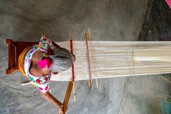 Woman waist weaving a beautiful traditional cotton fabric