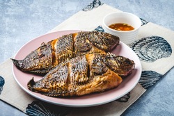 Famous Pinoy Ulam- Fried Tilapia with condiment on the side - Profile