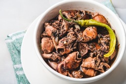 Adobong Pusit is a tasty squid dish cooked using the popular Filipino adobo method. 