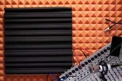Sound mixer and microphone record at acoustic foam. Music equipment concept in studio