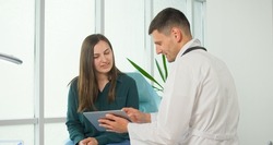 Young Woman at a Doctor'S Appointment in a Medical Clinic. Medical Examination, Consultation, a Confidential Conversation Between the Doctor and the Patient. Comfortable Stay in the Clinic