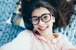 Young Charming  girl in glasses doing photo. People and technology concept