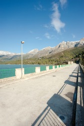 Reservoir dam in sunny winter landscape
