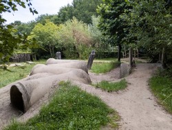 Green playground with tunnels. Green schoolyard. Outdoor playing. Playing outside in nature.