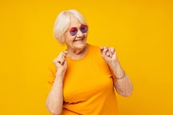 elderly woman in fashionable glasses isolated background