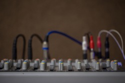 Microphone connectors plugged in a audio music mixing console.