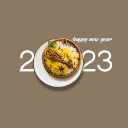 Happy New Year 2023 concept for restaurant brand isolated on brown background.new year concept