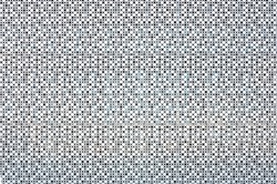 Grey perforated panels for facing the facade of the building. For background or texture