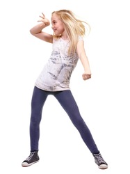 Lets party. Full length shot a young girl dancing against white background.